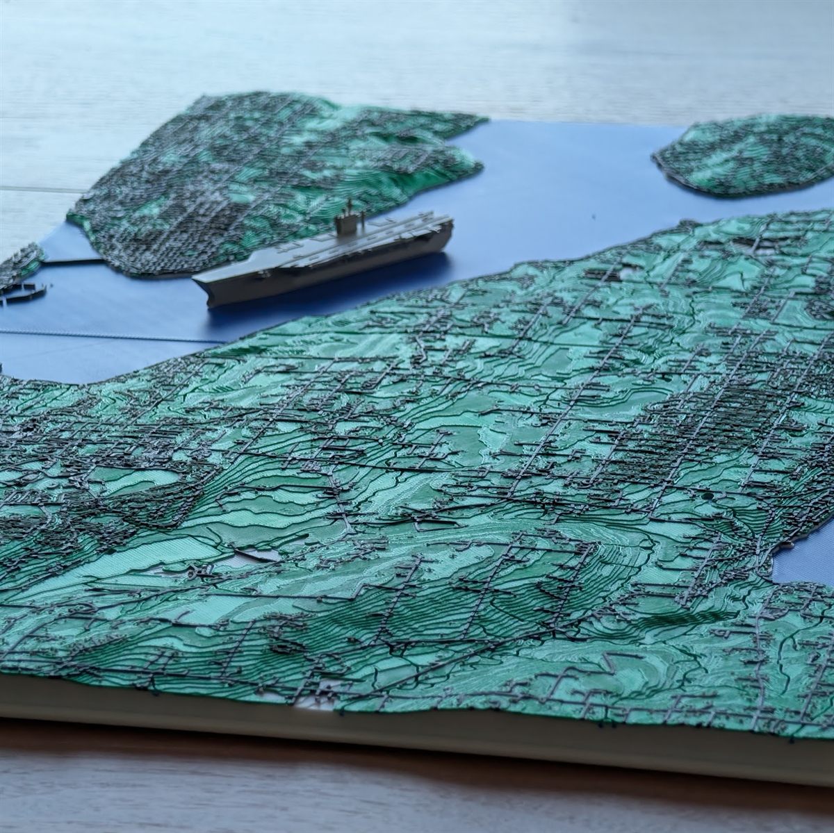 A custom 3D topographic map of a coastline